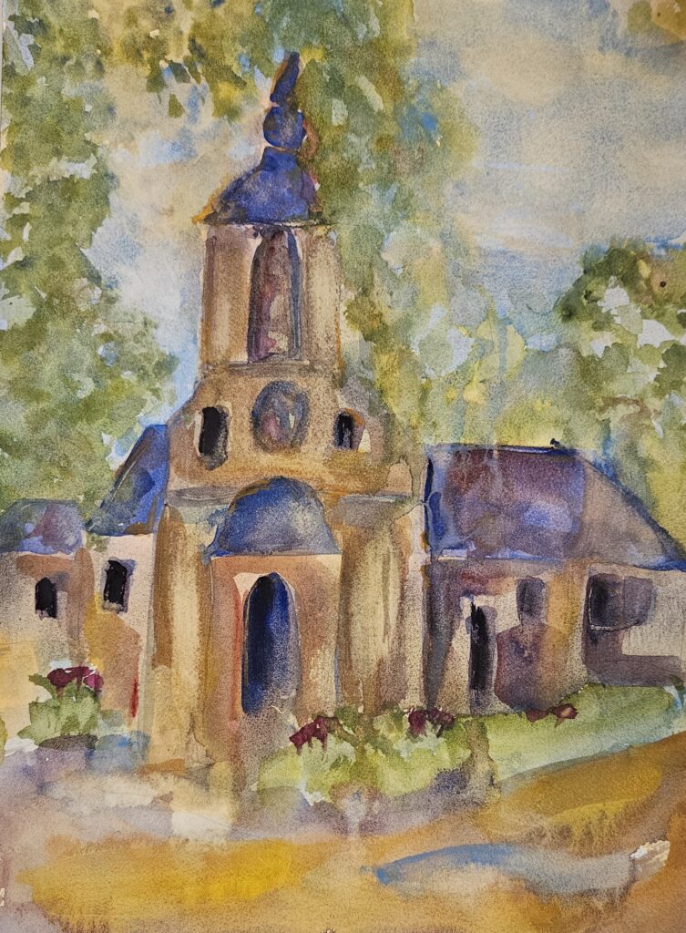 Chapelle Notre Dame de Grace Honfleur, original watercolor painting of a tan chapel with purple roofs. It is set under a cloudy sky with green trees and foliage around and a light brown roadway in front.